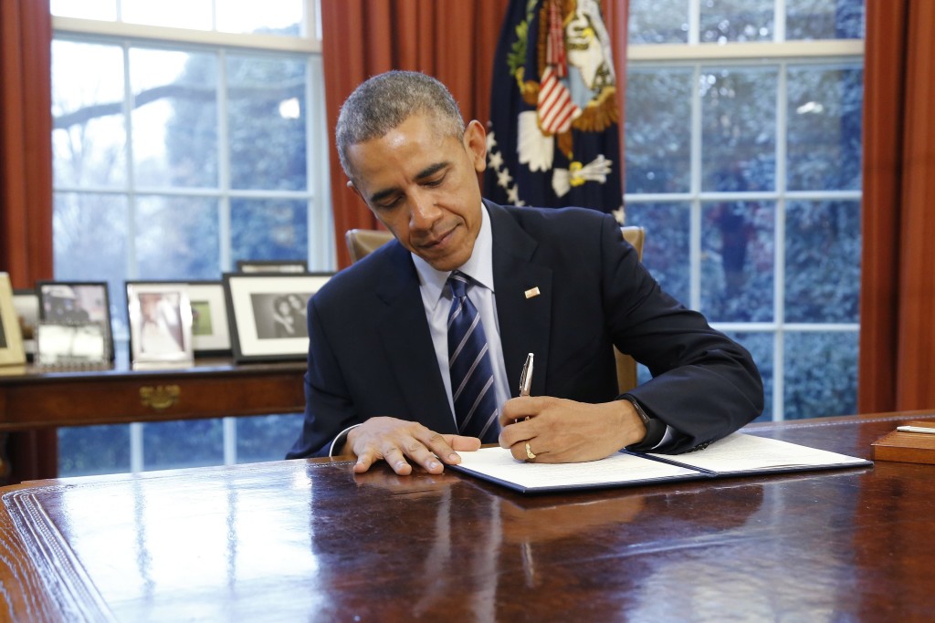 Barack Obama signing law/executive action