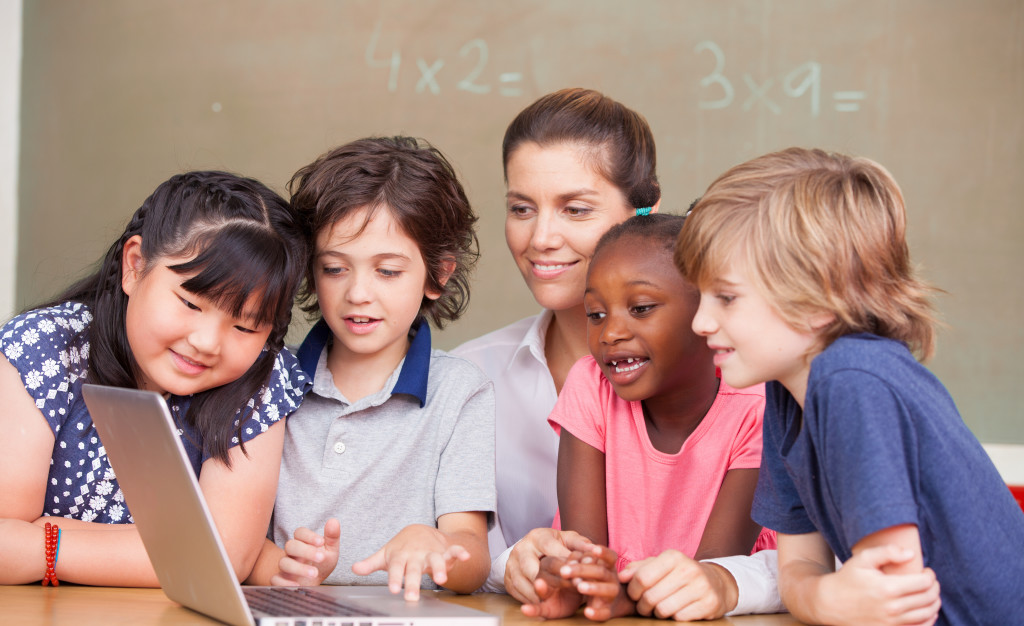 students in classroom with tech internet