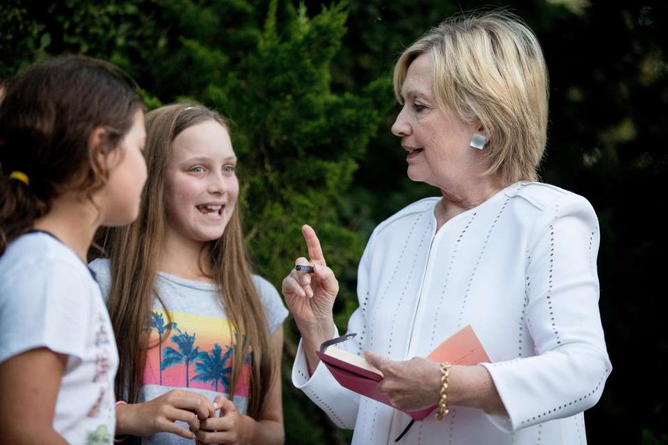 Hillary Clinton with young girls
