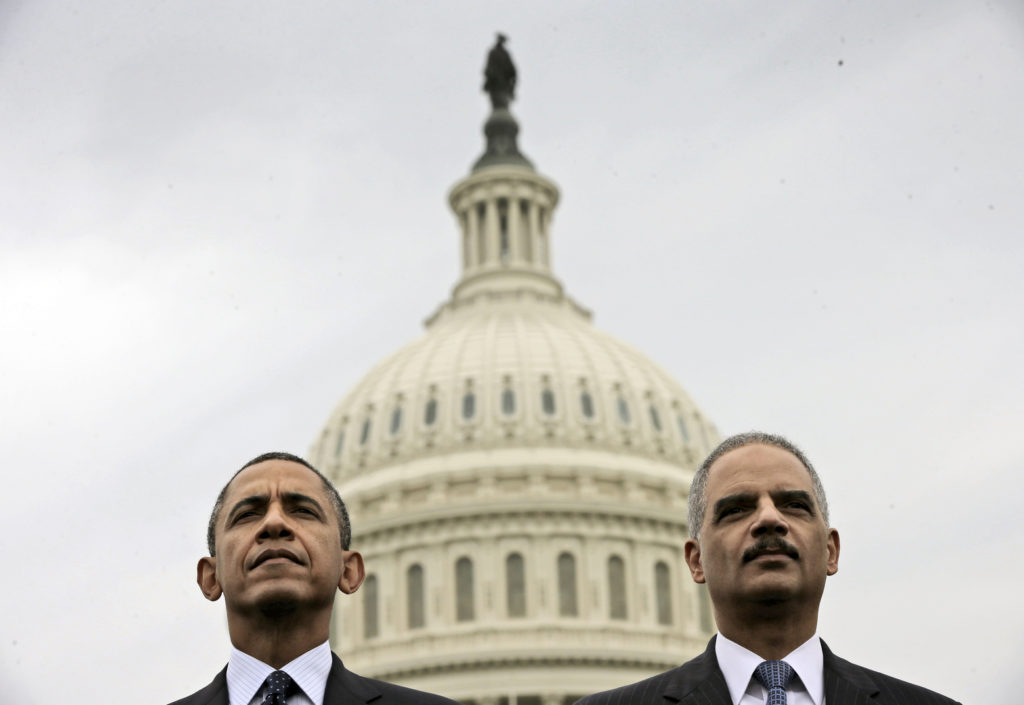 Democrats Obama and Eric Holder