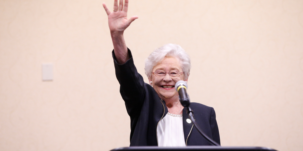 Kay Ivey waving