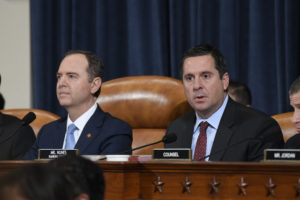 The Latest:  Representative Devin Nunes reads White House memo at start of hearing