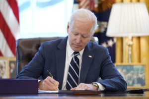 Joe Biden signs big virus aid bill before speech to nation